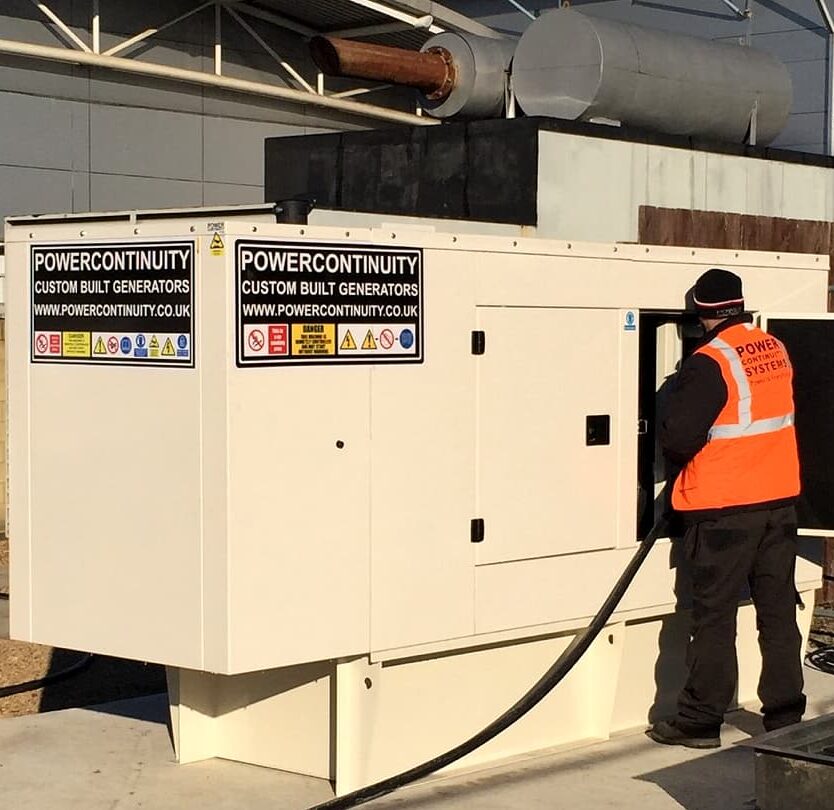 Power continuity engineer installing canopied generator