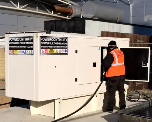 Power continuity engineer installing canopied generator