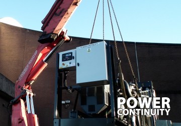 Power continuity 600kva generator lifted into position
