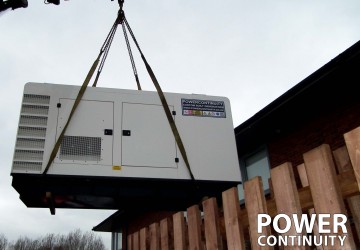 Power continuity diesel generator being moved into site