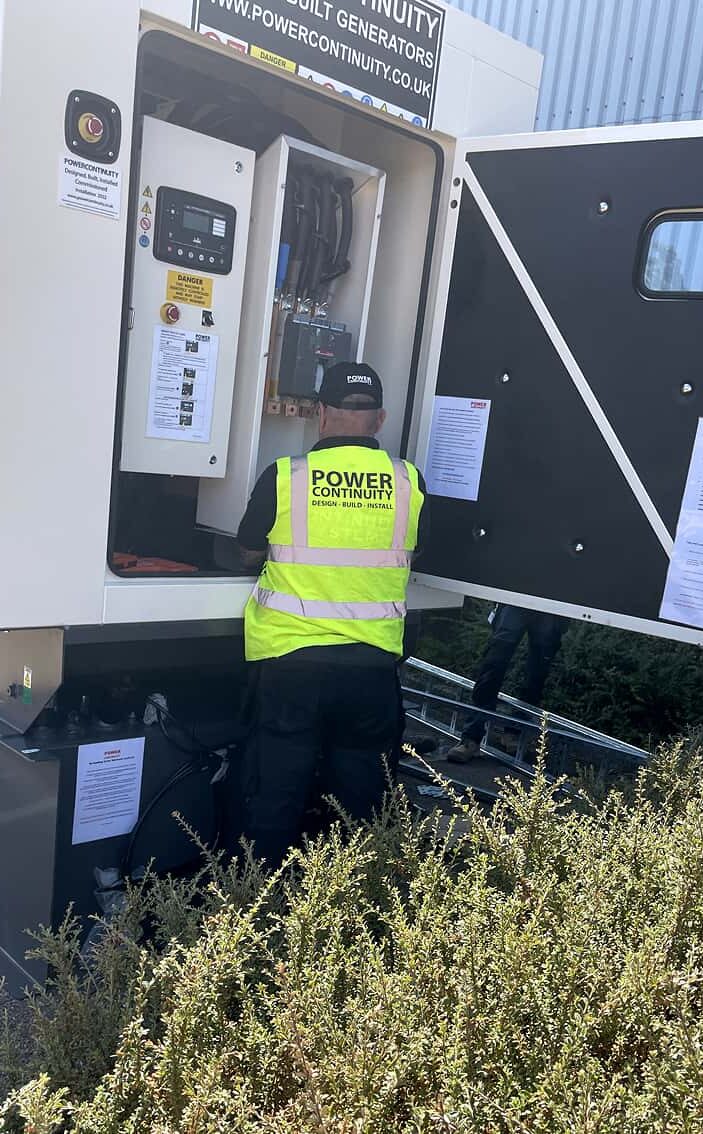 Power continuity engineer checking oil pressure