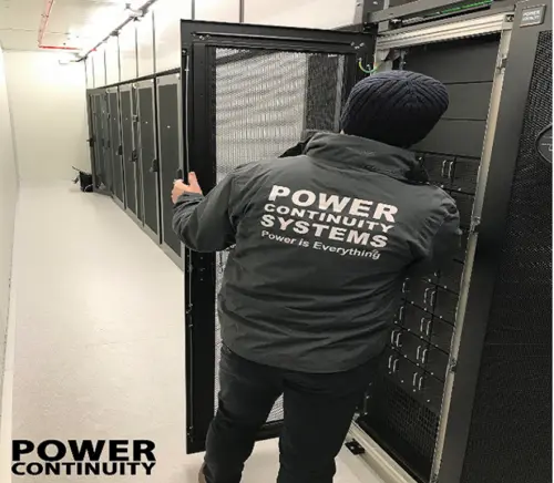 Power continuity engineer inspecting a data centre