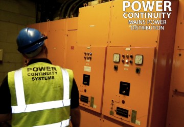 Power continuity engineer inspecting lv mains distribution switchgear panel