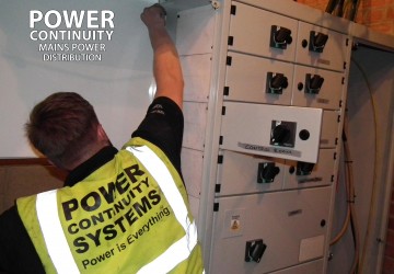 Power continuity engineer installing lv mains distribution switchgear panel