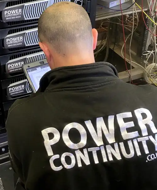Power continuity engineer installing single phase ups