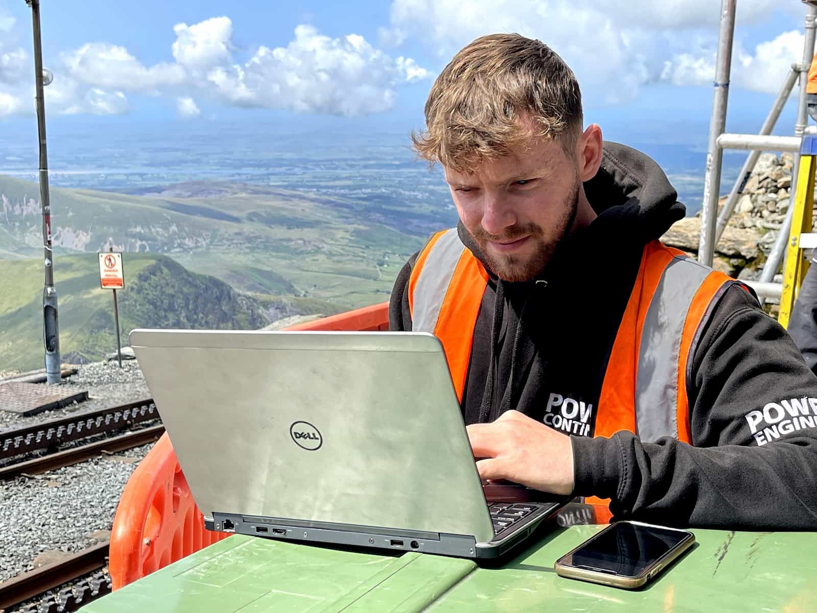 Power continuity engineer remotely monitoring a ups