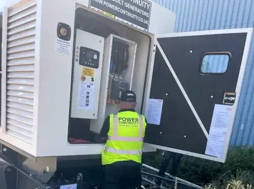Power continuity engineer servicing a diesel powered generator