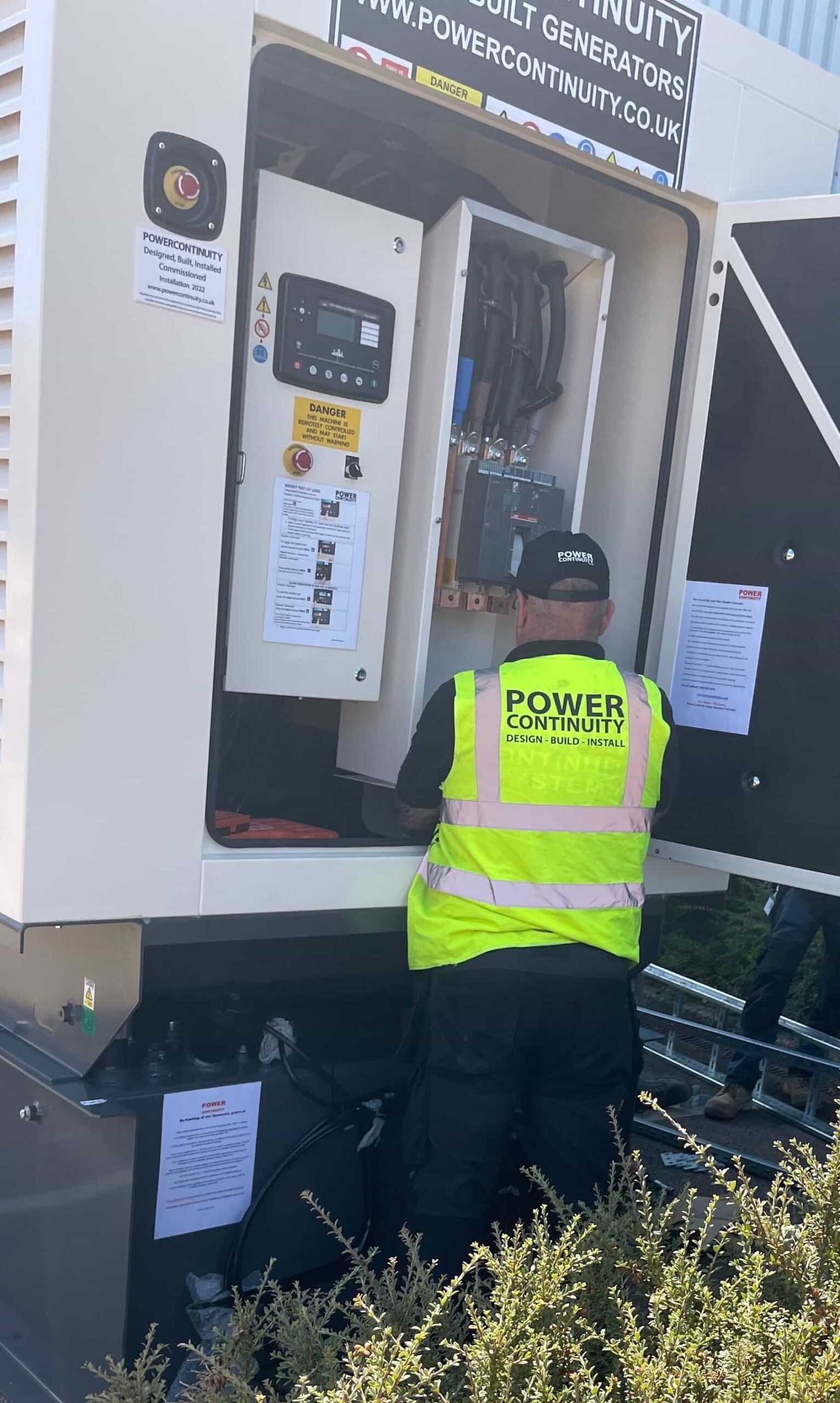 Power continuity engineer servicing a diesel powered generator
