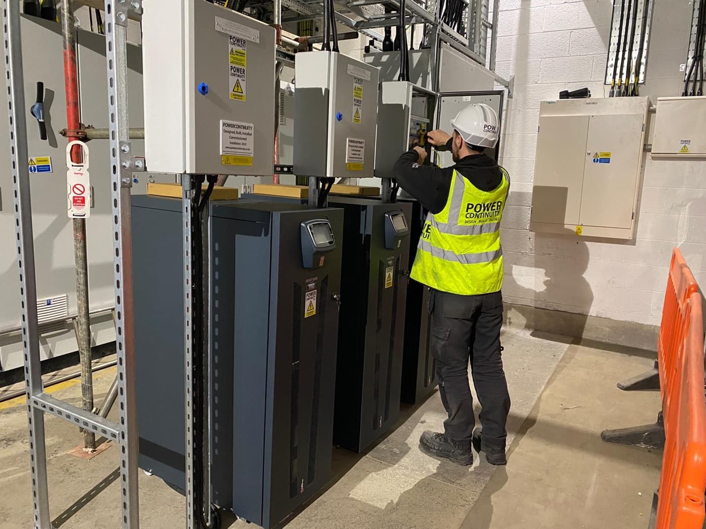 Power continuity engineer servicing a ups