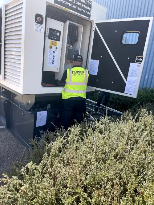 Power continuity engineer servicing diesel generator