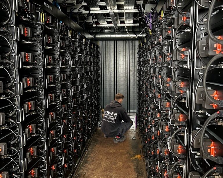 Power continuity engineer working inside a battery energy storage system
