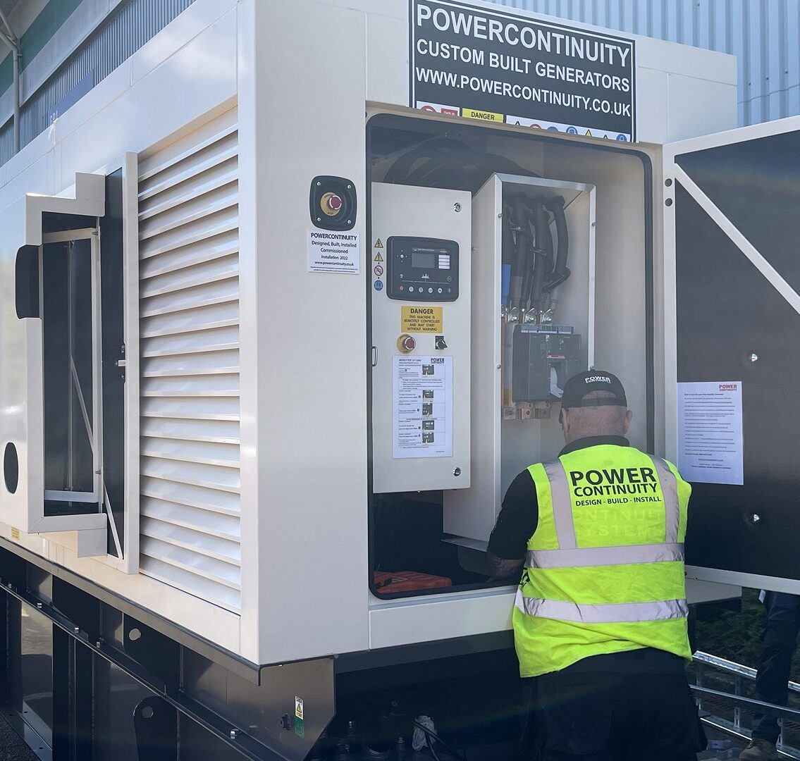 Power continuity engineer working on canopied generator