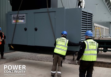 Power continuity engineers changing the location of a diesel generator