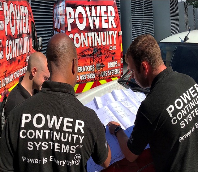 Power continuity engineers discussing plans for power protection