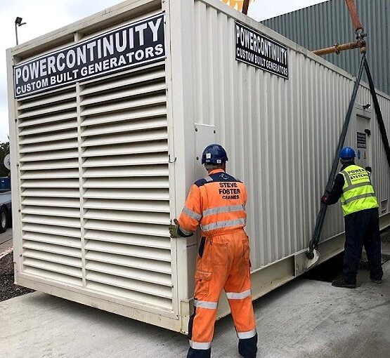 Power continuity engineers placing containerised generator