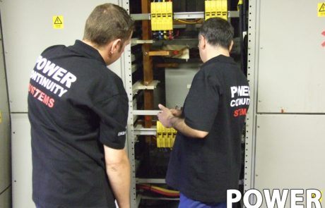 Power continuity engineers servicing a ups system
