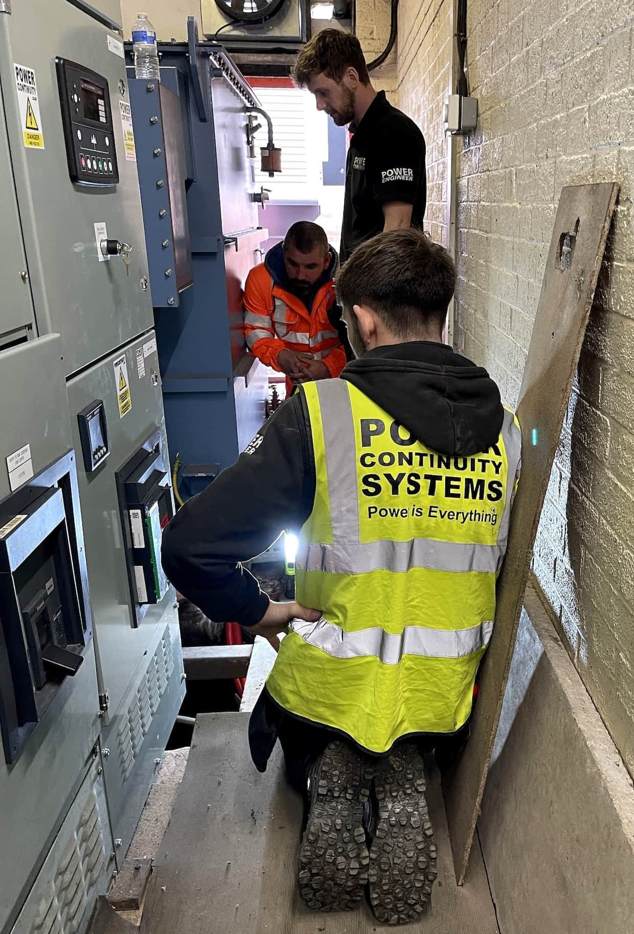 Power continuity engineers working on a lv panel