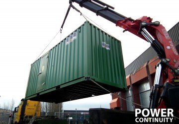 Power continuity green containerised generator transported by a crane mounted lorry